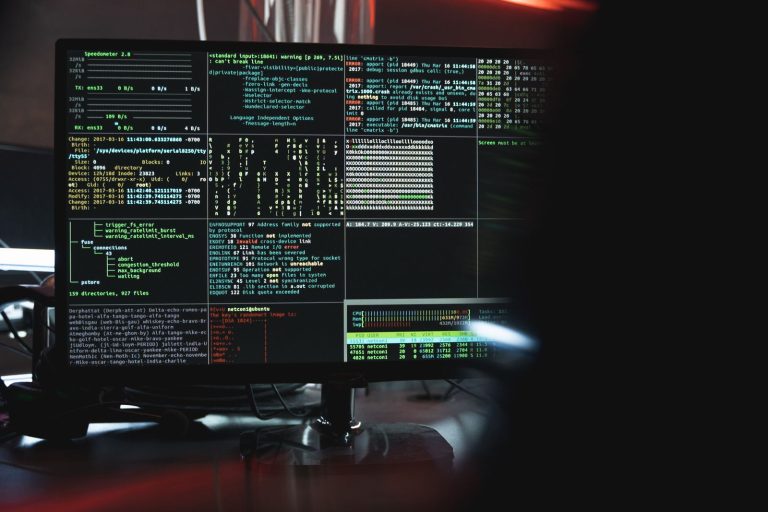 Close-up of a monitor showing code and security data, illustrating the critical PHP vulnerability