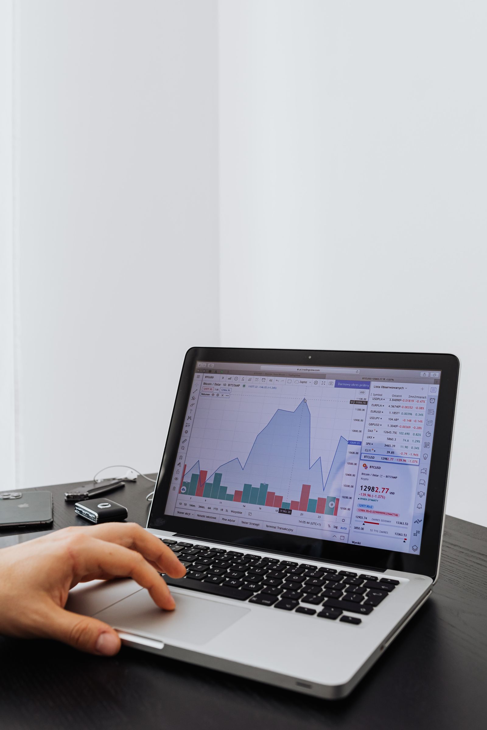 Person reviewing campaign graphs on a laptop while planning ChatGPT ads measurement after the GPT-6 launch